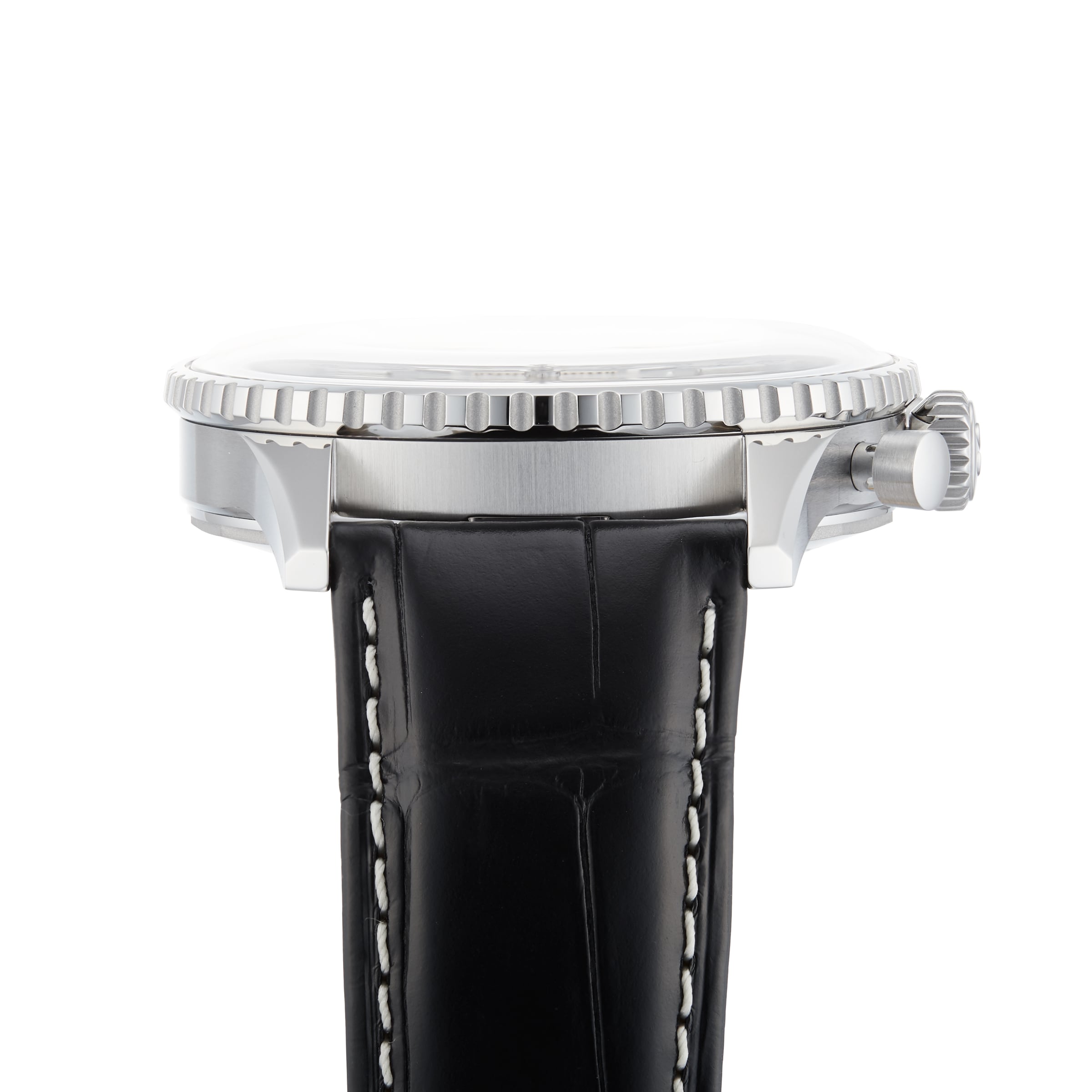 Side view of the Breitling Navitimer B01 Chronograph 46, showcasing its silver case, textured bezel, and black leather strap with white stitching, reminiscent of the iconic Navitimer design.