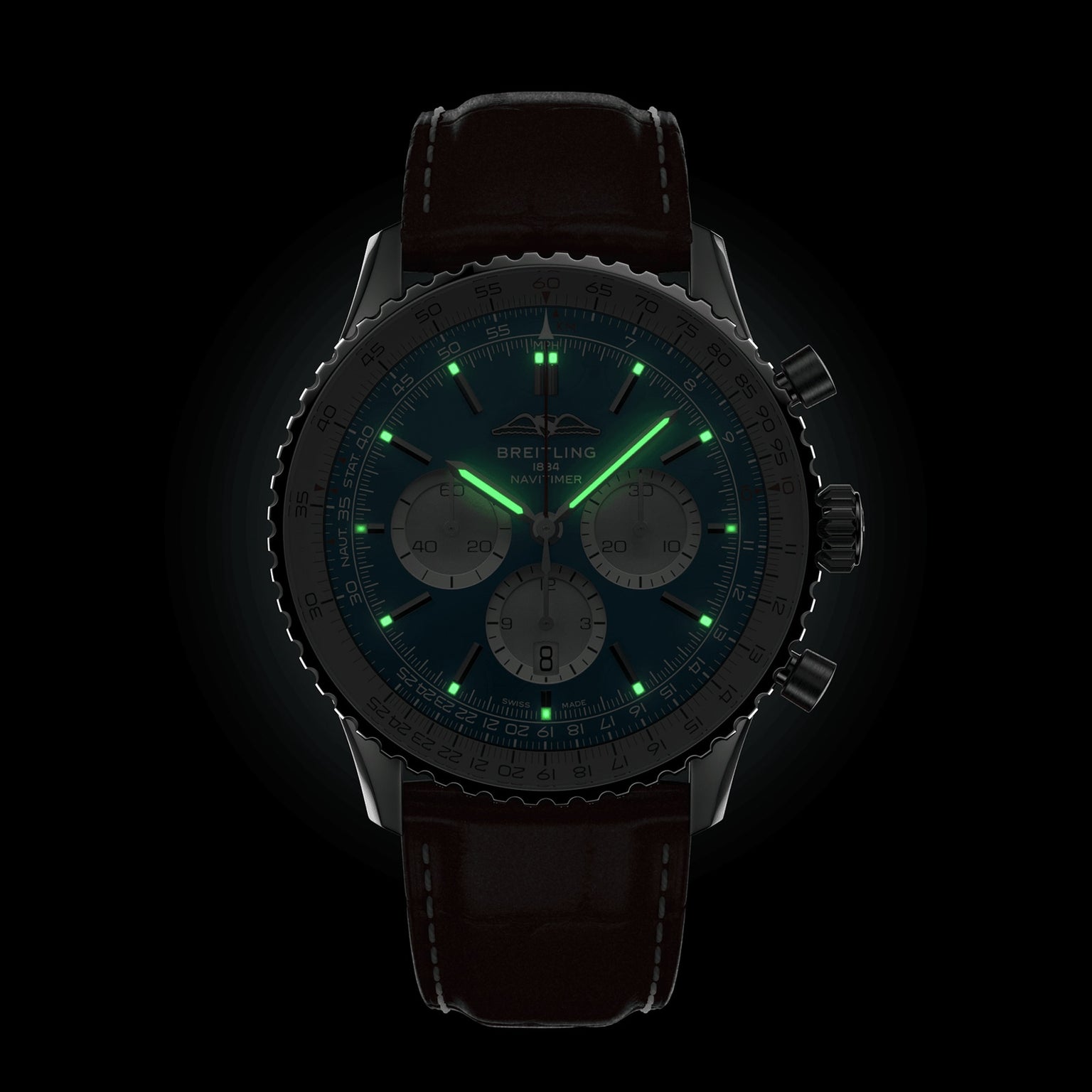 The Breitling Navitimer B01 Chronograph 46 features a black strap and illuminated green hands and markers, set against a black background—an iconic pilot’s watch crafted for precision and style.