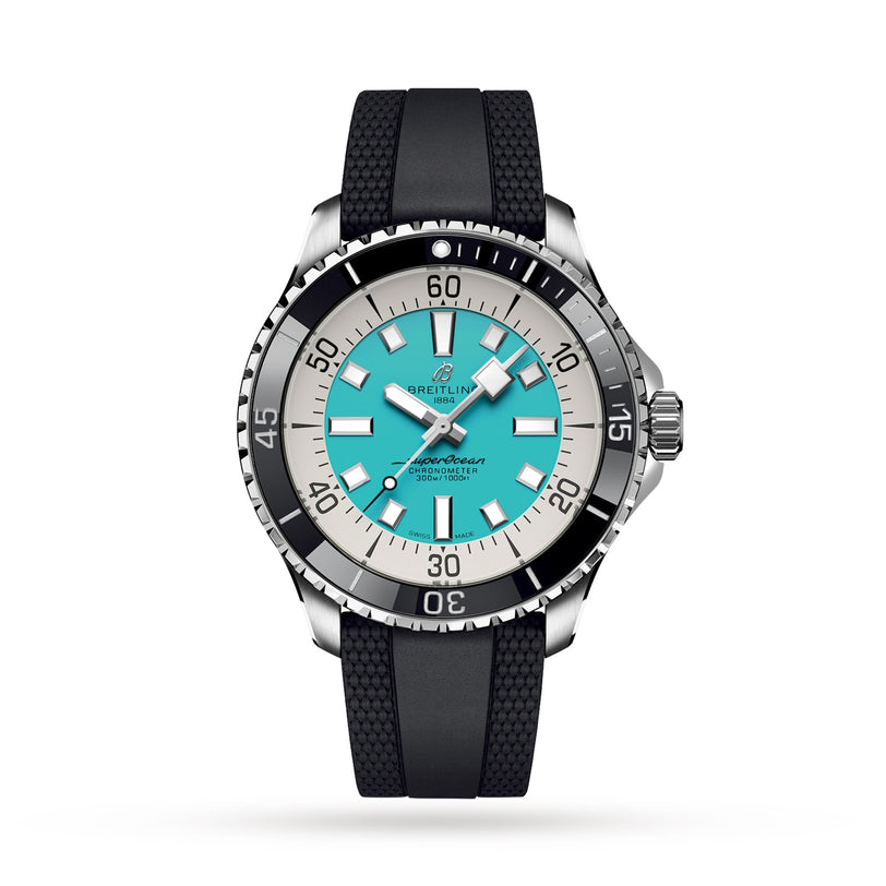 The Breitling Superocean Automatic 44 features a turquoise dial, black and silver bezel, stainless steel case, black rubber strap, and silver hour markers on a white background.