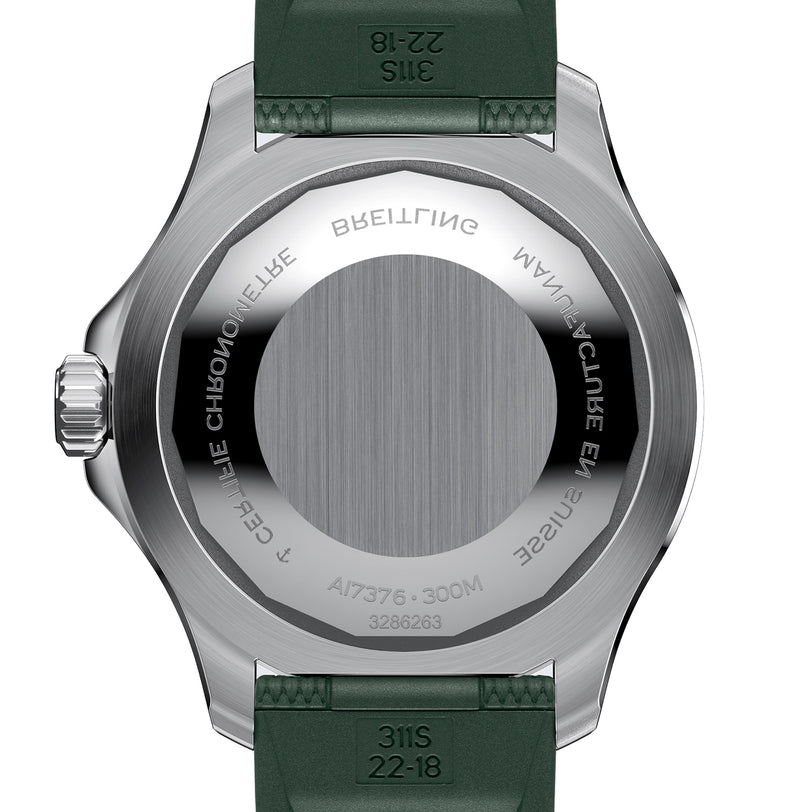 The back of the Breitling Superocean Automatic 44 features engraved text, serial numbers, and a brushed metal finish that accentuates its water-resistant design and green strap.