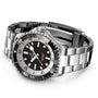 The Breitling Superocean Automatic 42 is a stainless steel wristwatch with a black and white dial, luminescent hands, and metal link bracelet, inspired by the 1960s Slow Motion dive watch, water resistant to 30 bar, shown on a white background.