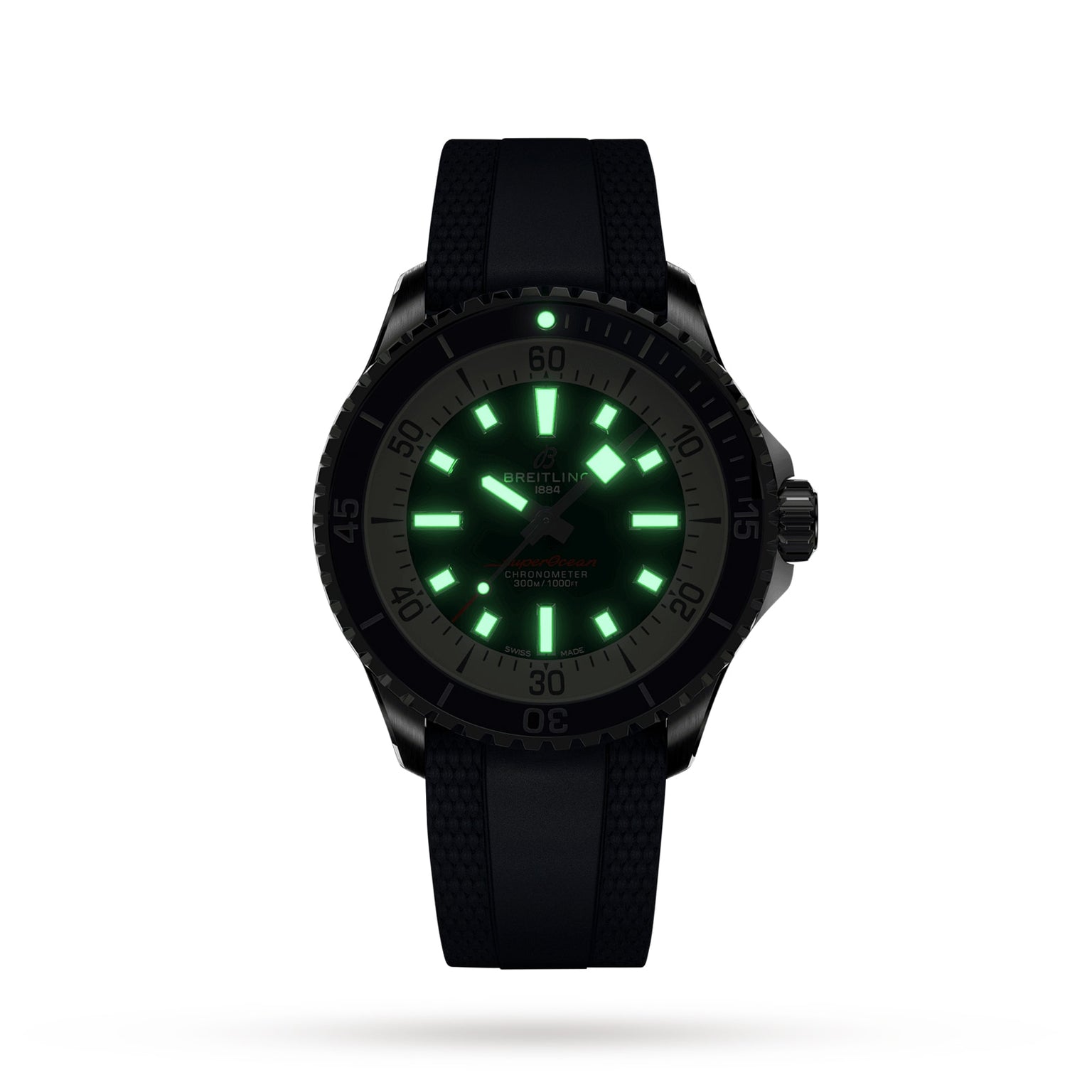 The Breitling Superocean Automatic 42 dive watch features a black design, textured strap, and glowing green hour markers and hands visible in the dark.
