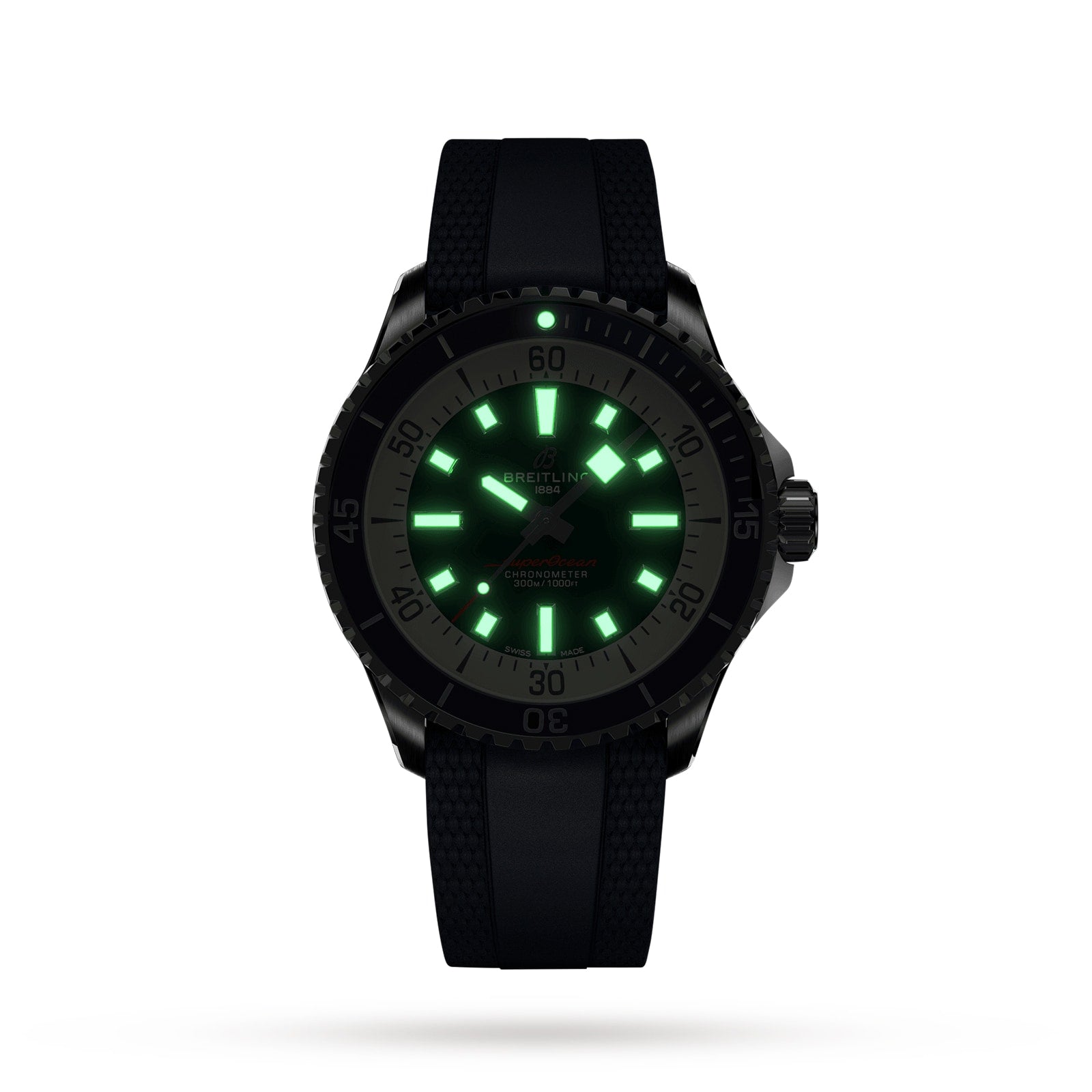 The Breitling Superocean Automatic 42 dive watch features a black design, textured strap, and glowing green hour markers and hands visible in the dark.