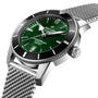 A close-up of the Breitling Superocean Heritage B20 Automatic 46 wristwatch featuring a green dial, date display, B20 movement, 46mm stainless steel case, and mesh bracelet.