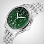 The Breitling Premier B01 Chronograph 42 boasts a stainless steel case, green chronograph dial with white Arabic numerals, three subdials, date window, and a polished silver metal bracelet.