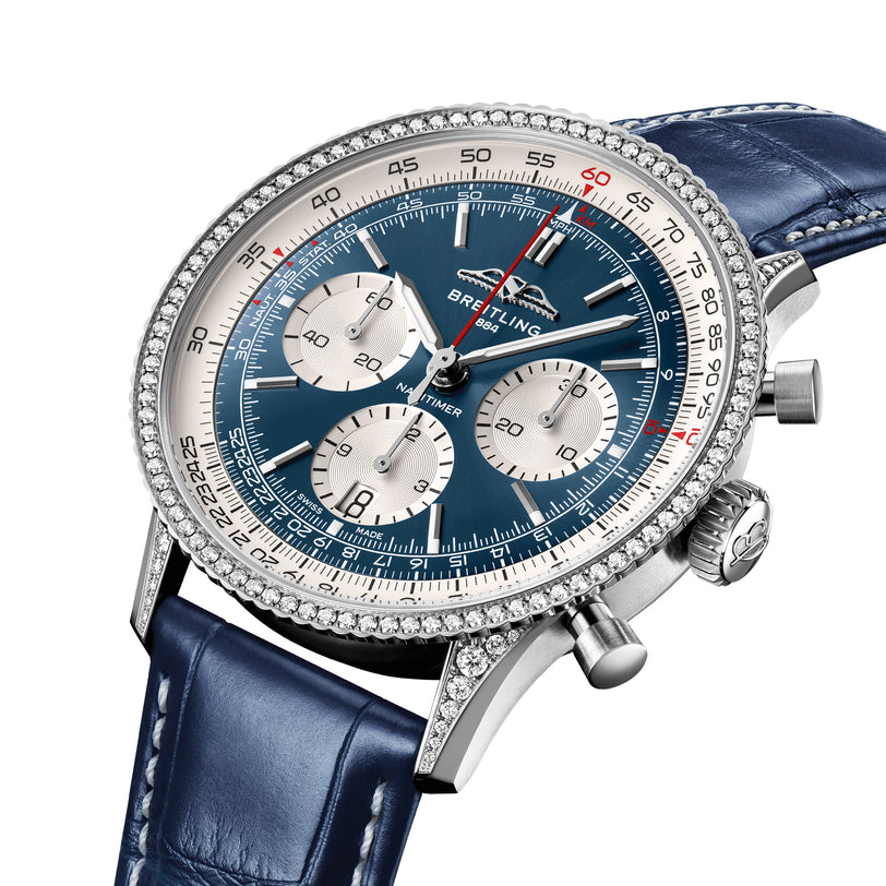 Close-up of a Breitling Navitimer B01 Chronograph 41 featuring a blue dial with three subdials, diamond bezel, stainless steel case, and blue leather strap.