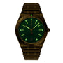 The Breitling Chronomat Automatic 36 Victoria Beckham is a limited edition wristwatch with a gold metal band and case, green dial, luminous markers and hands, and a date display at 6 o’clock.