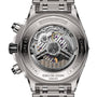 Close-up of the Super Chronomat B01 44 by Breitling, showing its titanium case back with engraved text and a transparent window displaying the detailed Breitling 01 calibre movement.