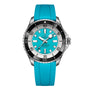 The Breitling Superocean Automatic 44 features a turquoise rubber strap and dial, silver case, black and silver bezel, bold white hour markers, and remarkable water resistance.