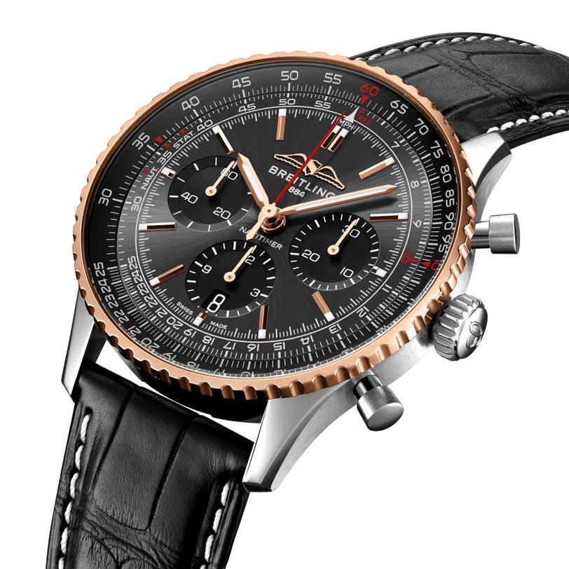 The Breitling Navitimer B01 Chronograph 43mm Limited Edition features a black dial with three subdials, rose gold bezel, silver stainless steel case, and black leather strap with white stitching.