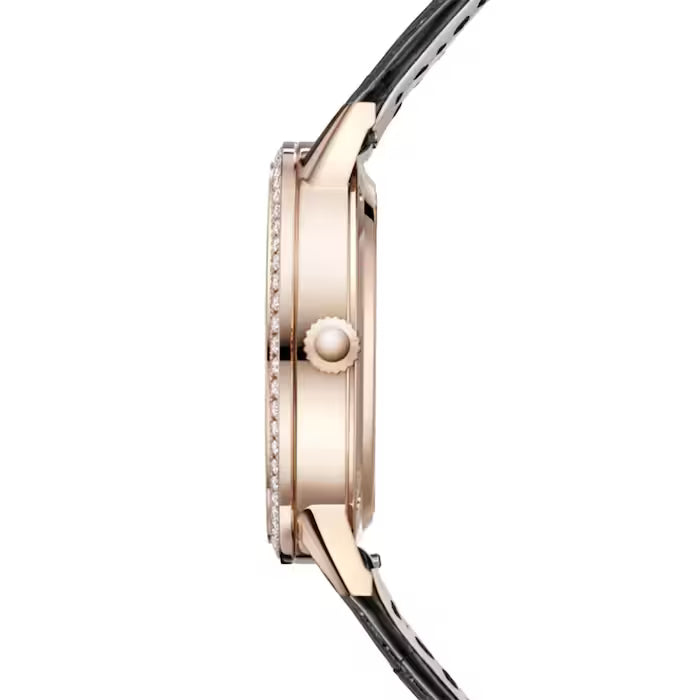 Side view of the Jaeger-LeCoultre Rendez-Vous Moon Medium, a luxury ladies' watch with round pink gold case, single crown, diamond-set bezel, and an elegant black leather strap.