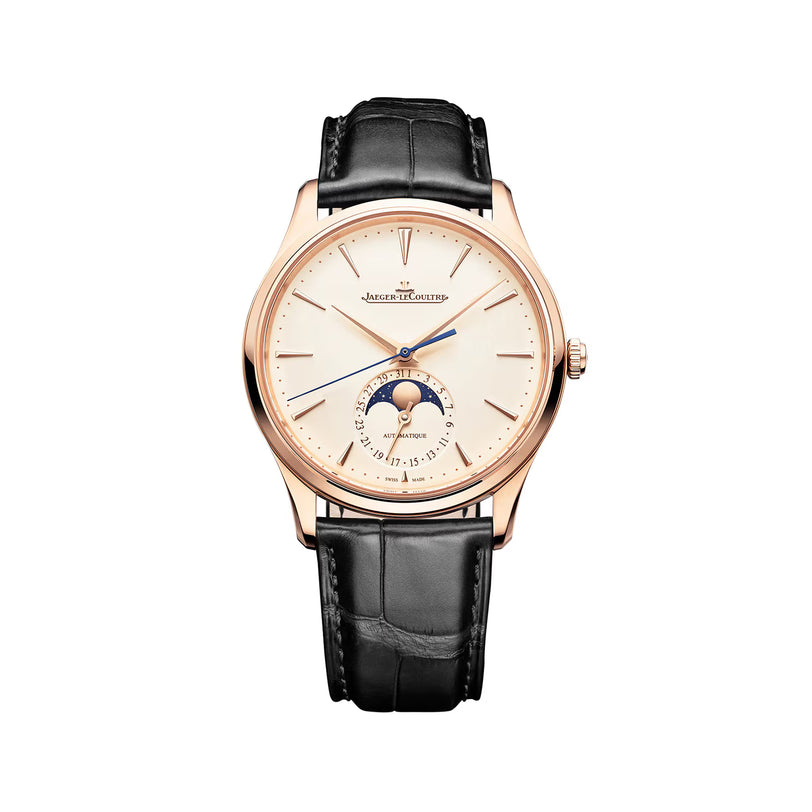 The Jaeger-LeCoultre Master Ultra Thin Moon Cream is a luxury 18K pink gold watch with a black leather strap, white dial, blue hands, and a moonphase and date subdial at 6 o’clock.