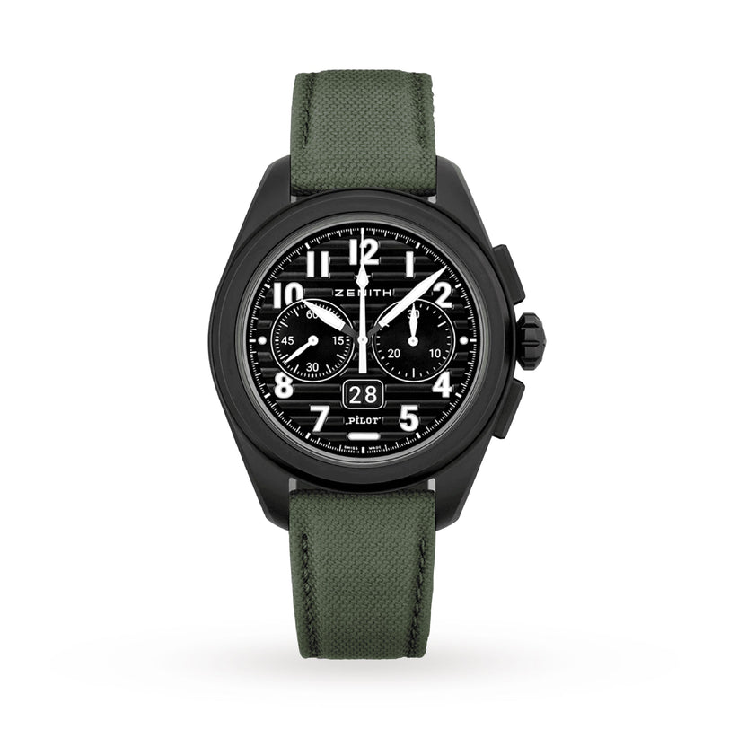 The Zenith Pilot Big Date Flyback is a black chronograph wristwatch featuring a black ceramic case, black dial with white numerals, two subdials, and a green fabric strap, displayed on a white background.