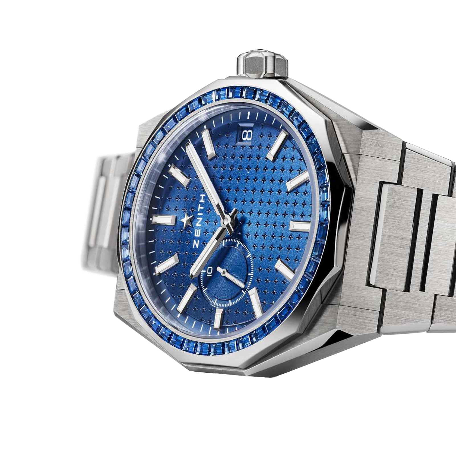 The Zenith Defy Skyline Sapphire wristwatch features a blue dial with blue gemstone markers, date display, and metal bracelet, inspired by the Defy Skyline collection, showcased on a white background.