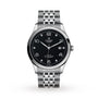 The TUDOR 1926 wristwatch features a silver case, black dial with diamond hour markers, date window, and a metal bracelet band.