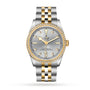 A TUDOR Black Bay One 31 S&G wristwatch with a silver dial, yellow gold markers, diamond bezel, and a stainless steel and gold bracelet is displayed on a white background.