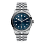 The TUDOR Black Bay One 41 is a stainless steel wristwatch featuring a blue dial, luminescent hour markers, and a five-link bracelet, offering unisex chic style. Shown here against a white background.