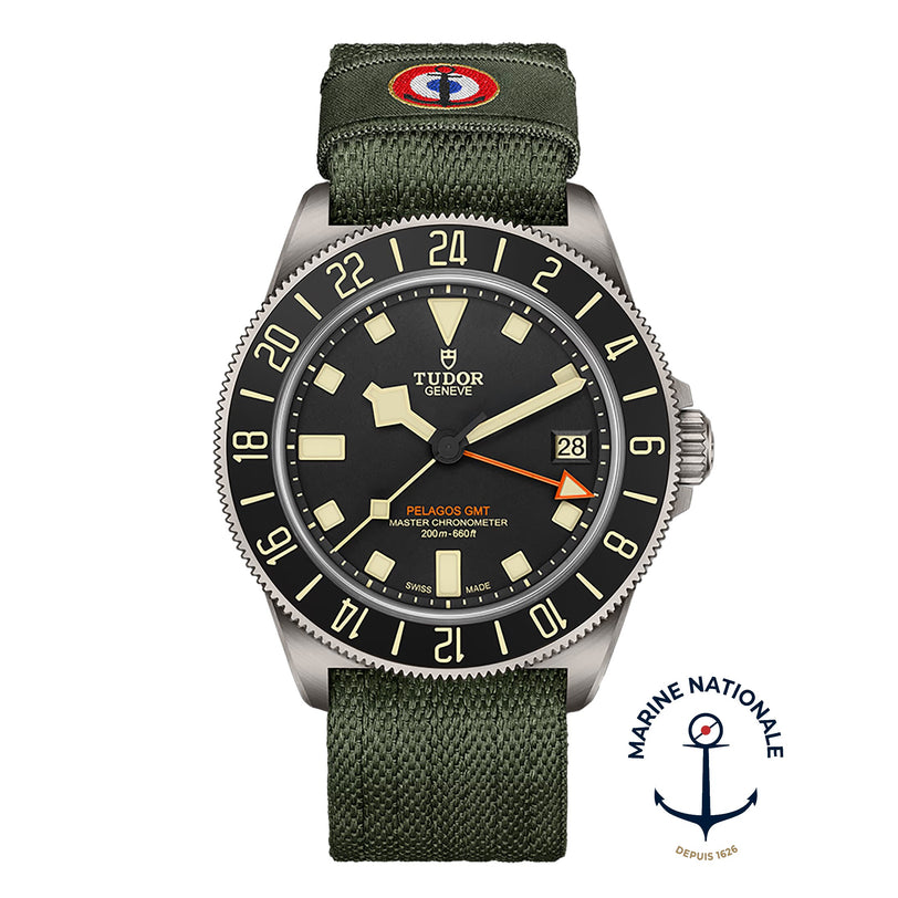 TUDOR Pelagos FXD GMT watch with green fabric strap, featuring the Marine Nationale logo at the bottom right.