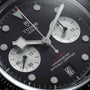 Close-up of the TUDOR Black Bay Chrono watch face featuring two subdials, a date window, and 200m water resistance text.