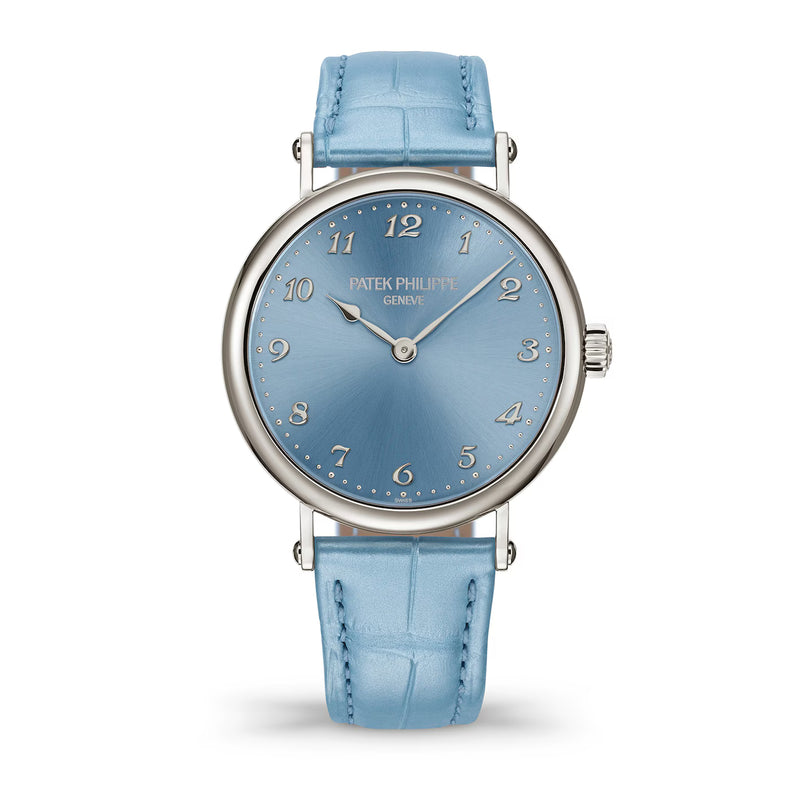 Watch with blue strap and blue dial on a white background