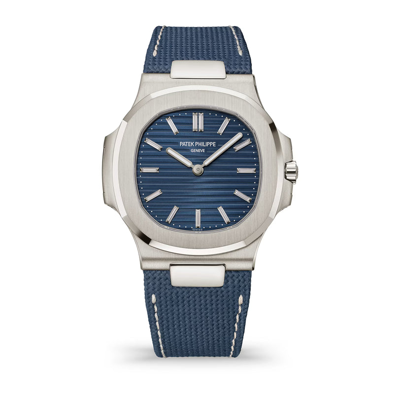 Patek Philippe watch with blue strap and face on a white background