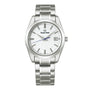 The Grand Seiko Quartz Heritage features a snowflake dial, silver hour markers, blue second hand, date at 3 o’clock, and a stainless steel bracelet in a sleek 37mm titanium case.