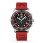 The Luminox Pacific Diver Chronograph Diver is a sporty wristwatch with a red band, black dial, silver casing, three subdials, and a date display.