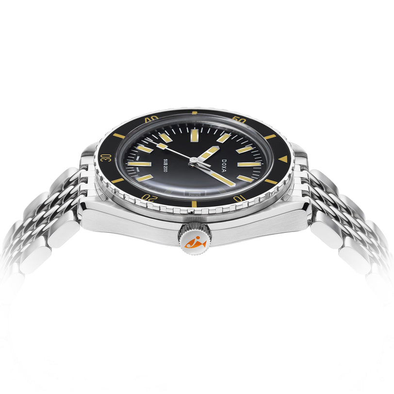 The DOXA Sub 200 Sharkhunter diver’s watch in 316L stainless steel is shown from a low side angle, showcasing its black dial with yellow markers, metal bracelet, unidirectional rotating bezel, crown, and case depth.