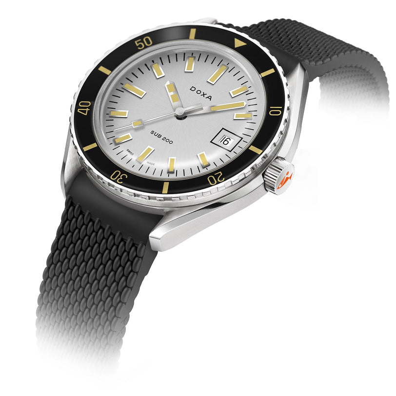 The DOXA Sub 200 Searambler is a silver divers watch with a unidirectional rotating bezel, white dial, date at 3 oclock, sapphire crystal, and a textured black rubber strap.