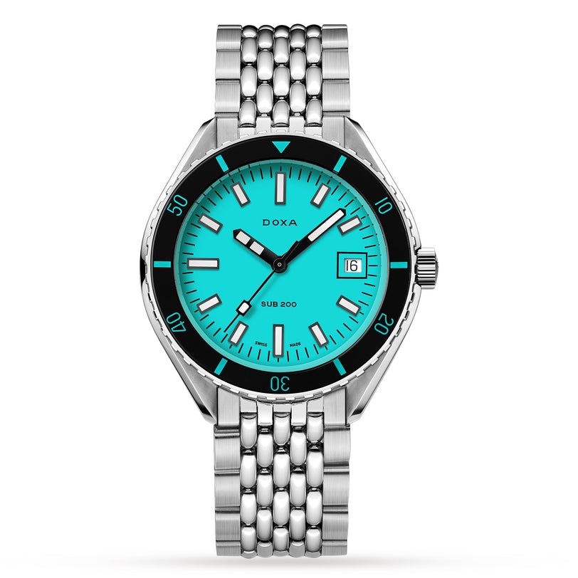 The DOXA Sub 200 Aquamarine is a diver’s watch in 316L stainless steel with a turquoise dial, unidirectional rotating bezel, date window at 3 o’clock, and silver link bracelet.