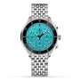 The DOXA Sub 200 C-Graph Aquamarine is a stainless steel chronograph wristwatch featuring a turquoise dial, black bezel, three subdials, and a metal link bracelet, shown displaying the time as 10:08.