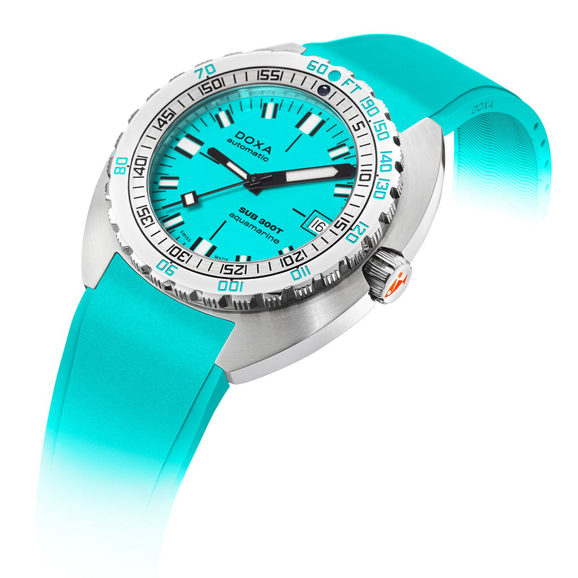 The DOXA Sub 300T Aquamarine divers watch features a silver case, turquoise dial and rubber strap, rotating bezel, bold hour markers, and Super-LumiNova for enhanced visibility.
