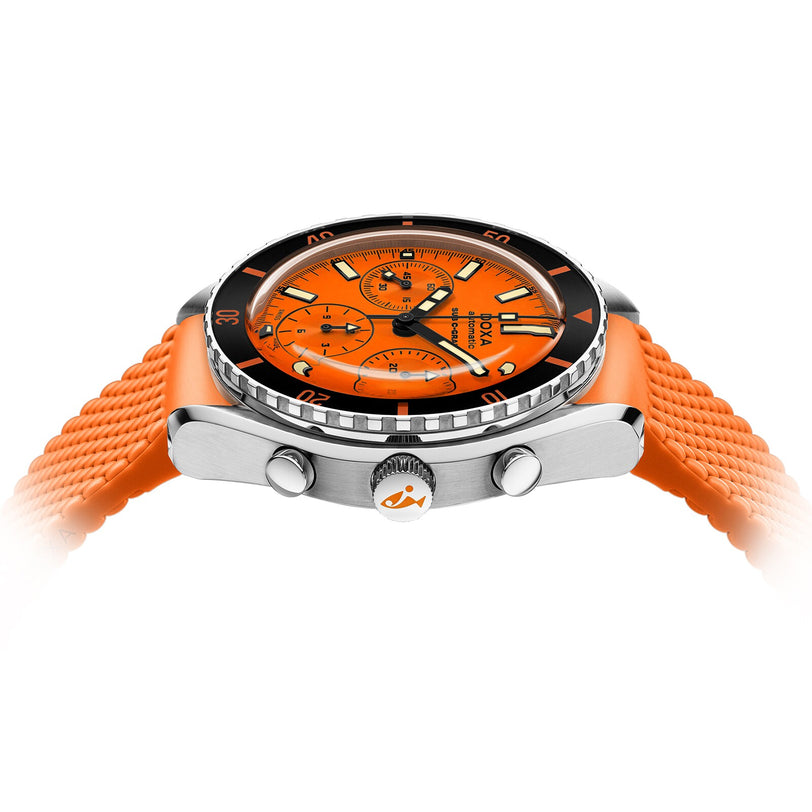 A close-up side view of the DOXA Sub 200 C-Graph Professional diver’s watch featuring an orange face and strap, black bezel, silver case, chronograph dials, metal pushers, and Swiss automatic movement.