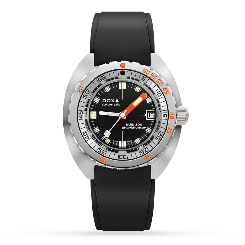 The DOXA Sub 300 Sharkhunter is a black diver’s watch with a round face, orange minute hand, date display, unidirectional bezel, and black rubber strap.