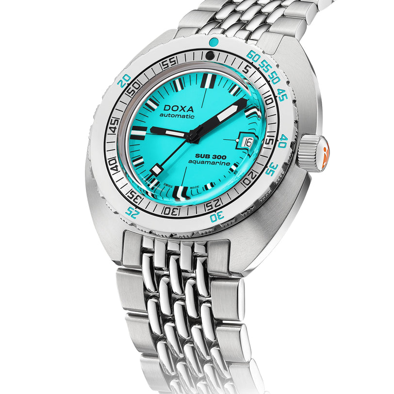 The DOXA Sub 300 Aquamarine is a stainless steel divers watch featuring a turquoise dial, unidirectional bezel, and metal bracelet.