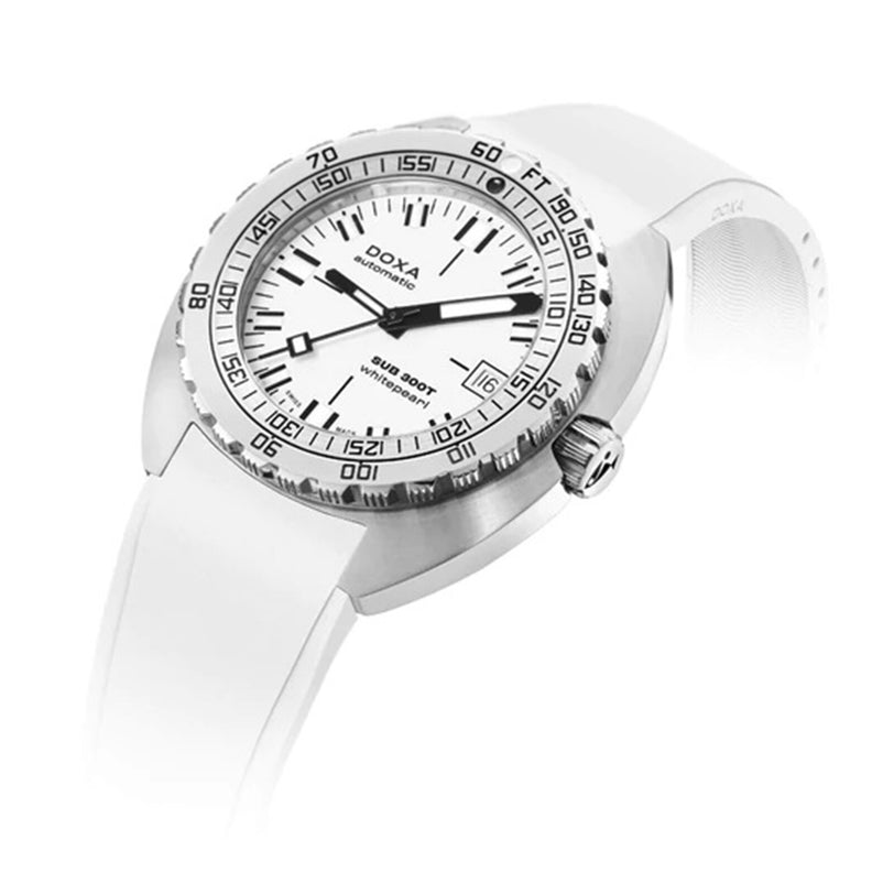 The DOXA Sub 300T Whitepearl is a stainless steel divers watch with a white dial, black markers, date display, numeraled bezel with helium release valve, and a white rubber strap. The DOXA logo appears on the dial.