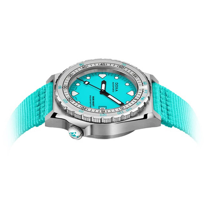 The DOXA Sub 600T Aquamarine is a stainless steel diver’s watch with a turquoise dial and strap, bold hour markers, and a rotating bezel.