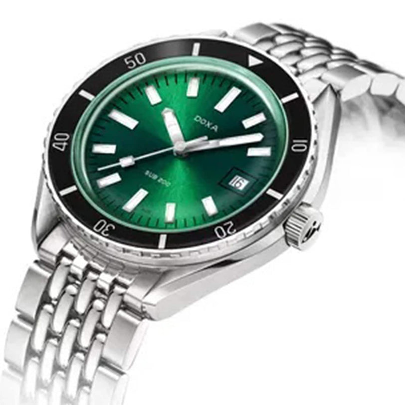 The DOXA Sub 200 Sea Emerald is a Swiss-inspired silver wristwatch with a green dial, white hour markers, black bezel, metal link band, and date display at 3 oclock—perfect for fans of precision and style.