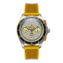 The William Wood Triumph Collection - Fuel Edition features a silver and gold wristwatch with a yellow strap and dual dials, showcased on a white background.