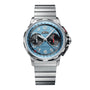 The Angelus Chronodate Titanium Storm Blue Titanium features a blue face, black subdials, and silver hour markers on a sleek titanium link band.