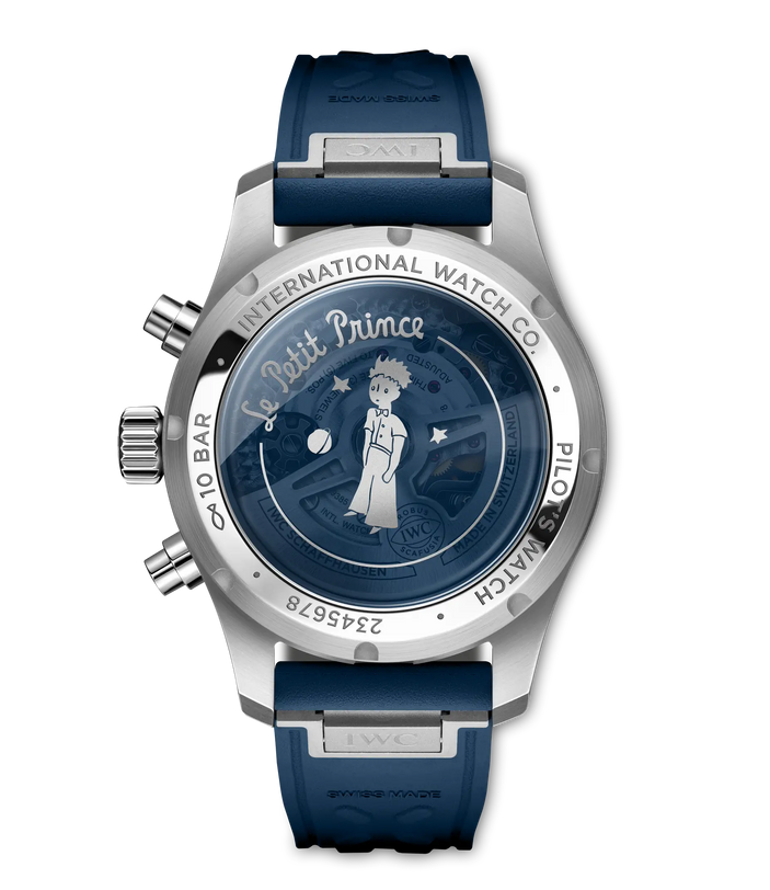 Stainless steel chronograph watch with dark blue dial featuring Le Petit Prince illustration, blue rubber strap, and pushers