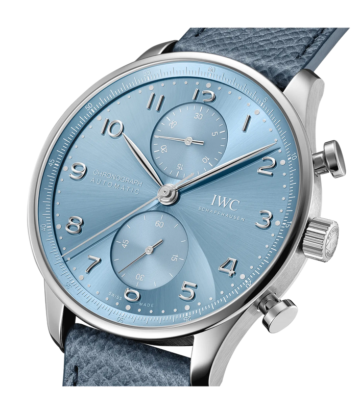 Close-up of the IWC Schaffhausen Portugieser Chronograph, featuring a metallic blue dial, silver hour markers, blue textured leather strap, two subdials, and polished silver hands for a sporty yet elegant look.