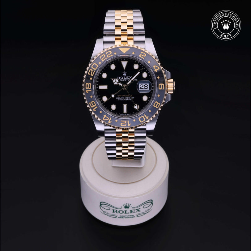Rolex Certified Pre-owned GMT M126713GRNR-0001 front on black background
