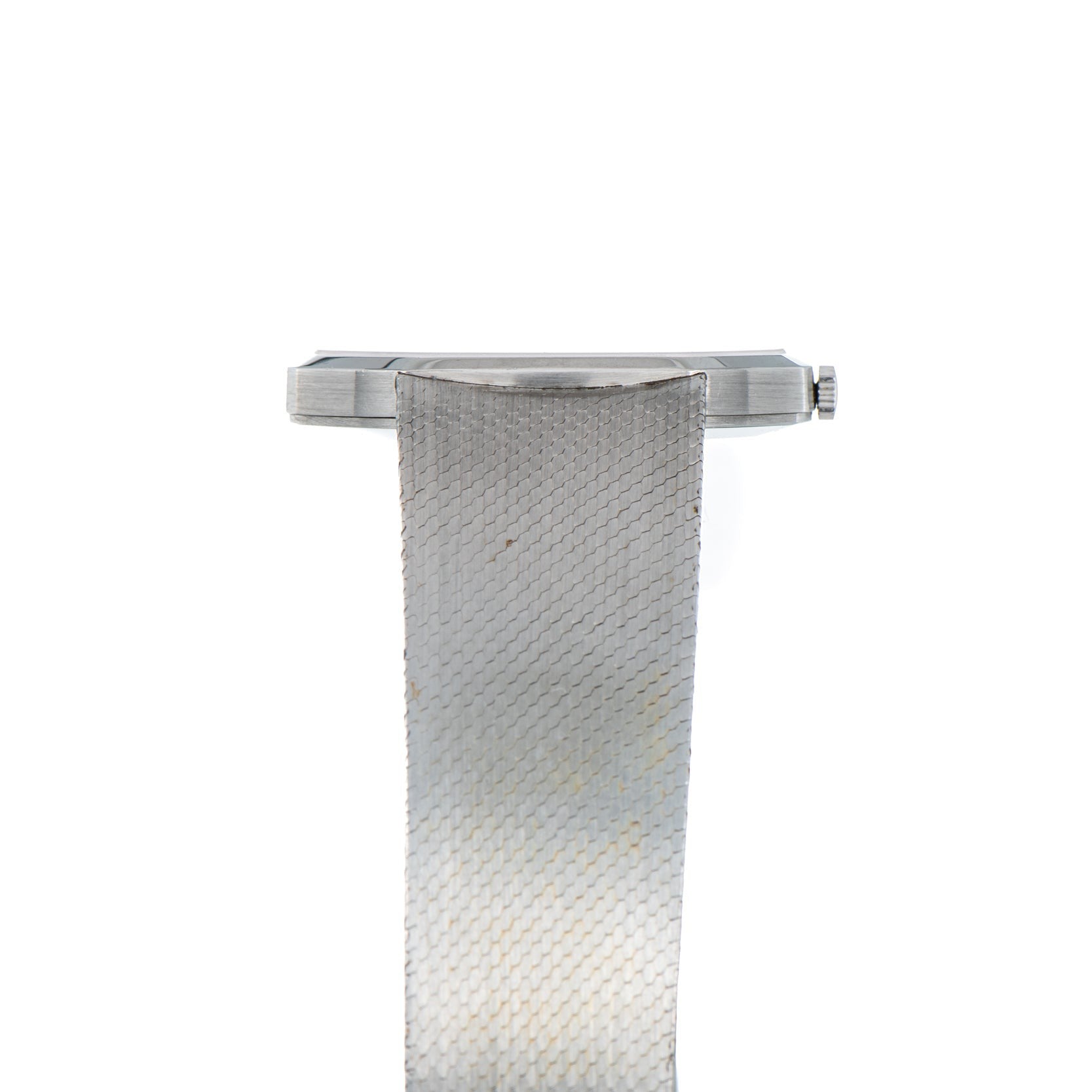 Side view of the Audemars Piguet Steel Dress Watch featuring a silver mesh metal band, displayed on a white background.