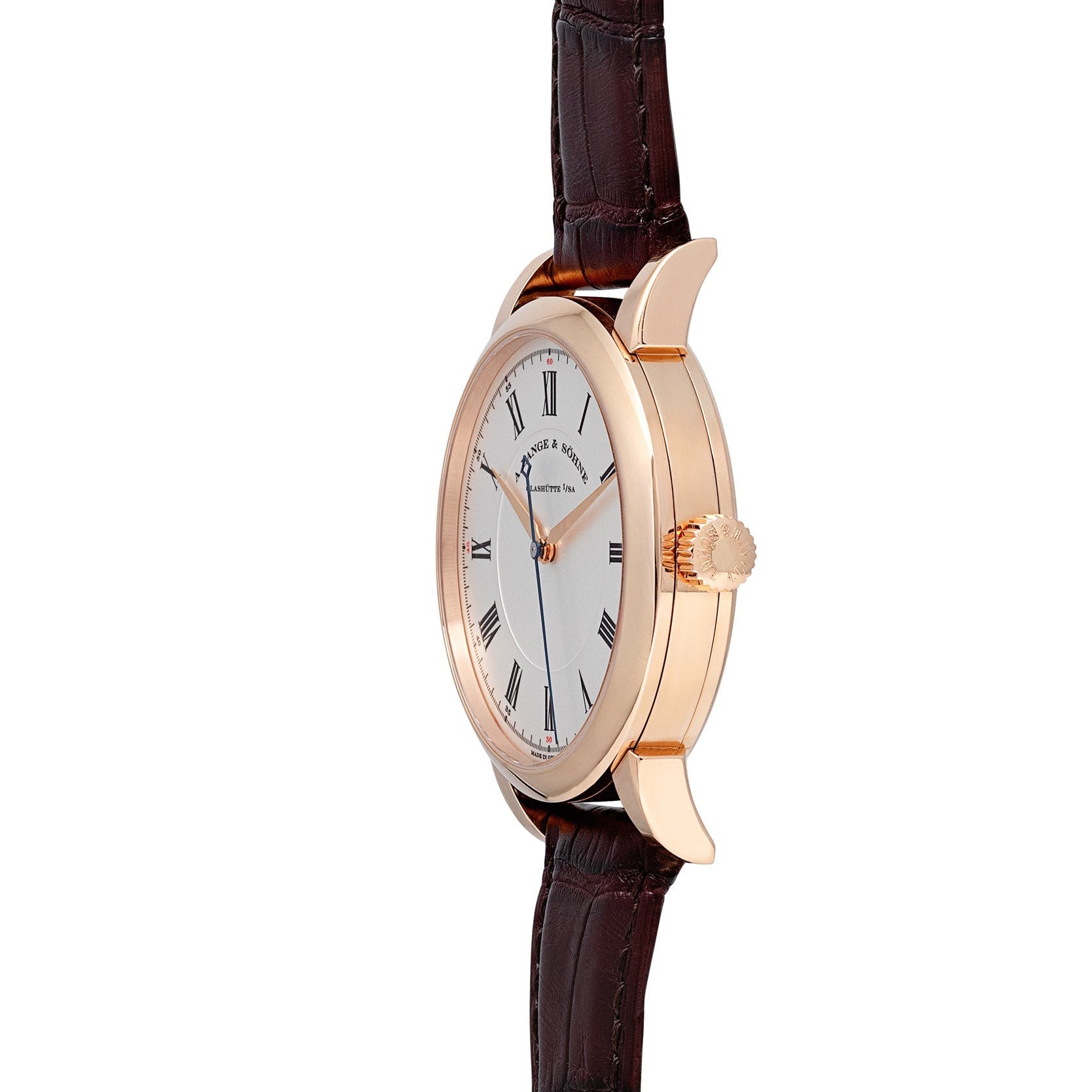 Side view of the Lange & Sohne Richard Lange gold wristwatch featuring a white dial, black Roman numerals, and a brown leather strap.