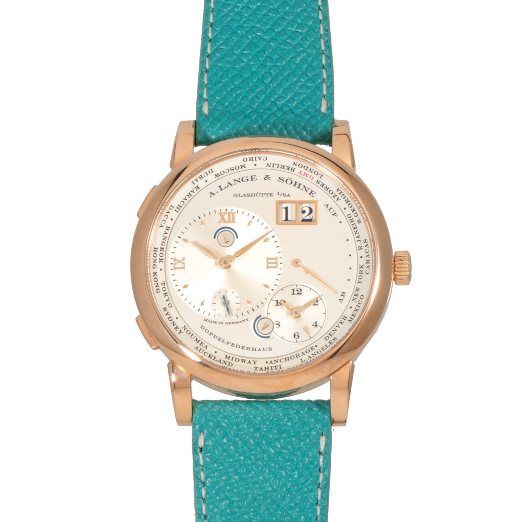 The Lange & Sohne Lange 1 Timezone features a white dial with Roman numerals and a turquoise leather strap.