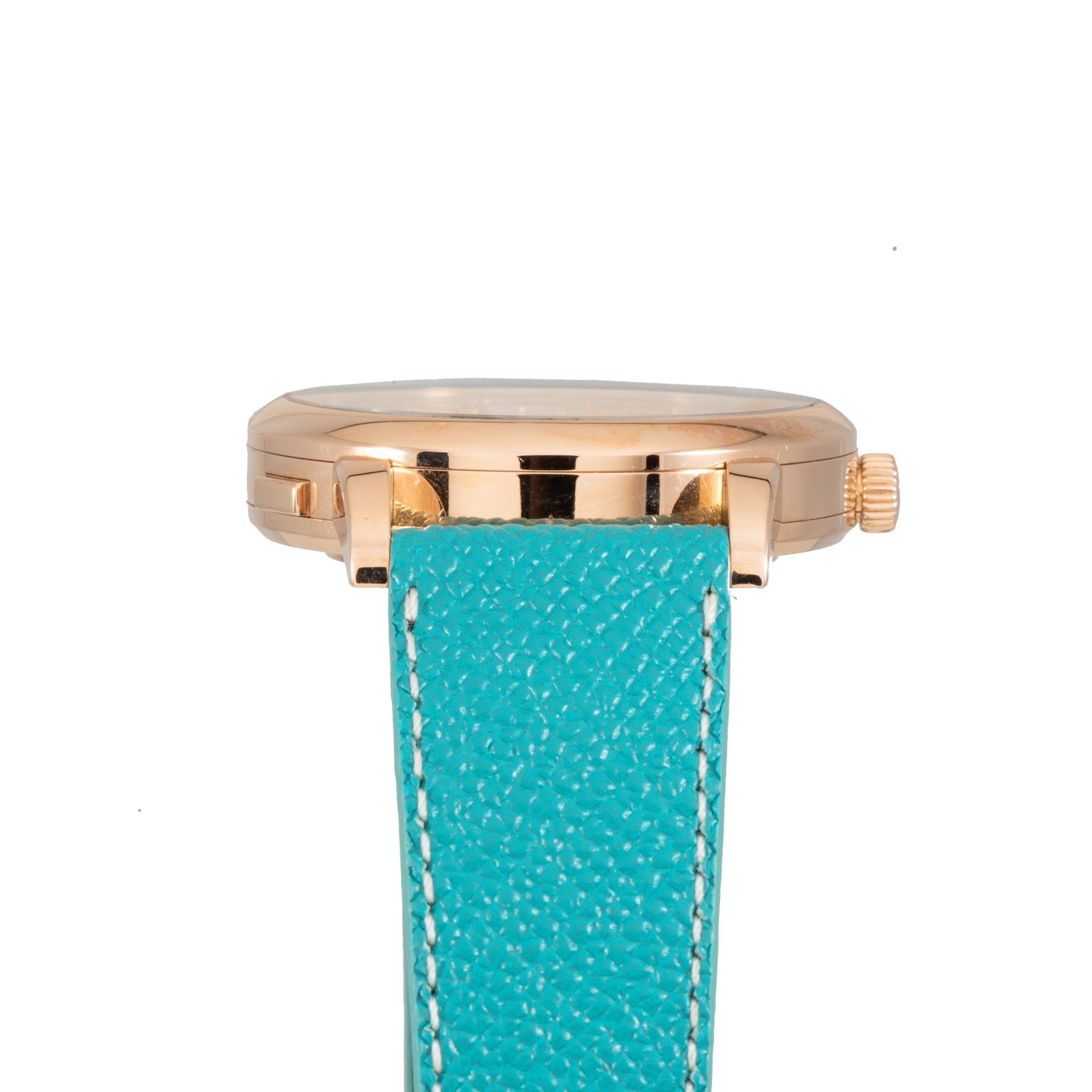 The Lange & Sohne Lange 1 Timezone features a gold case with a turquoise textured leather strap and white stitching, shown from the side.