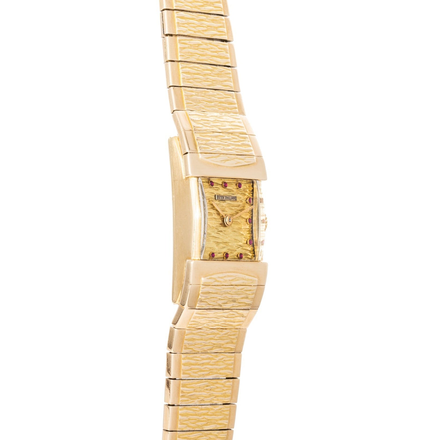 Side view of the Patek Philippe Yellow Gold Integrated Dress Watch featuring a textured band and rectangular case, displayed on a white background.