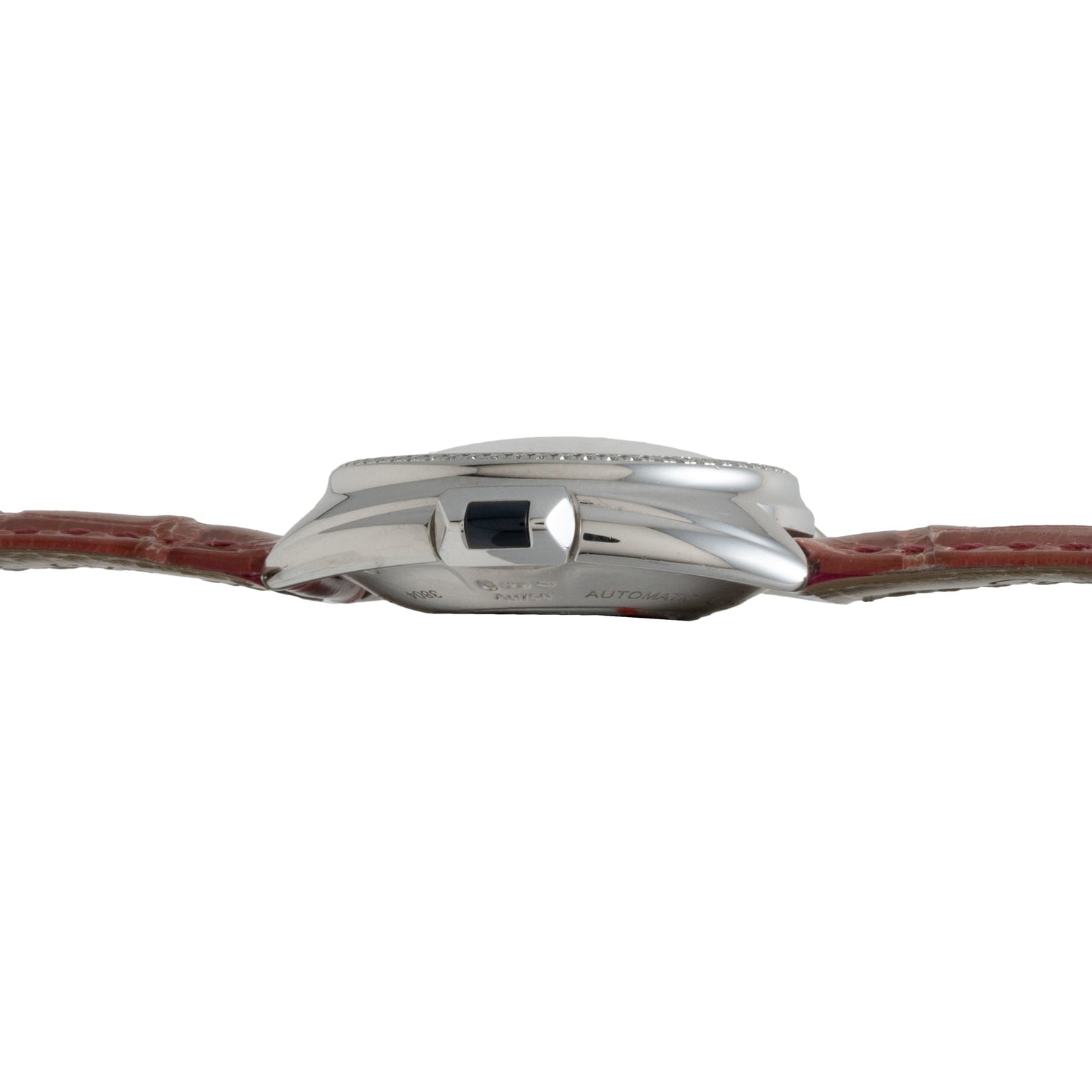 Side view of the Cartier Cle de Diamond, featuring a silver finish, red leather band, and dark crown.