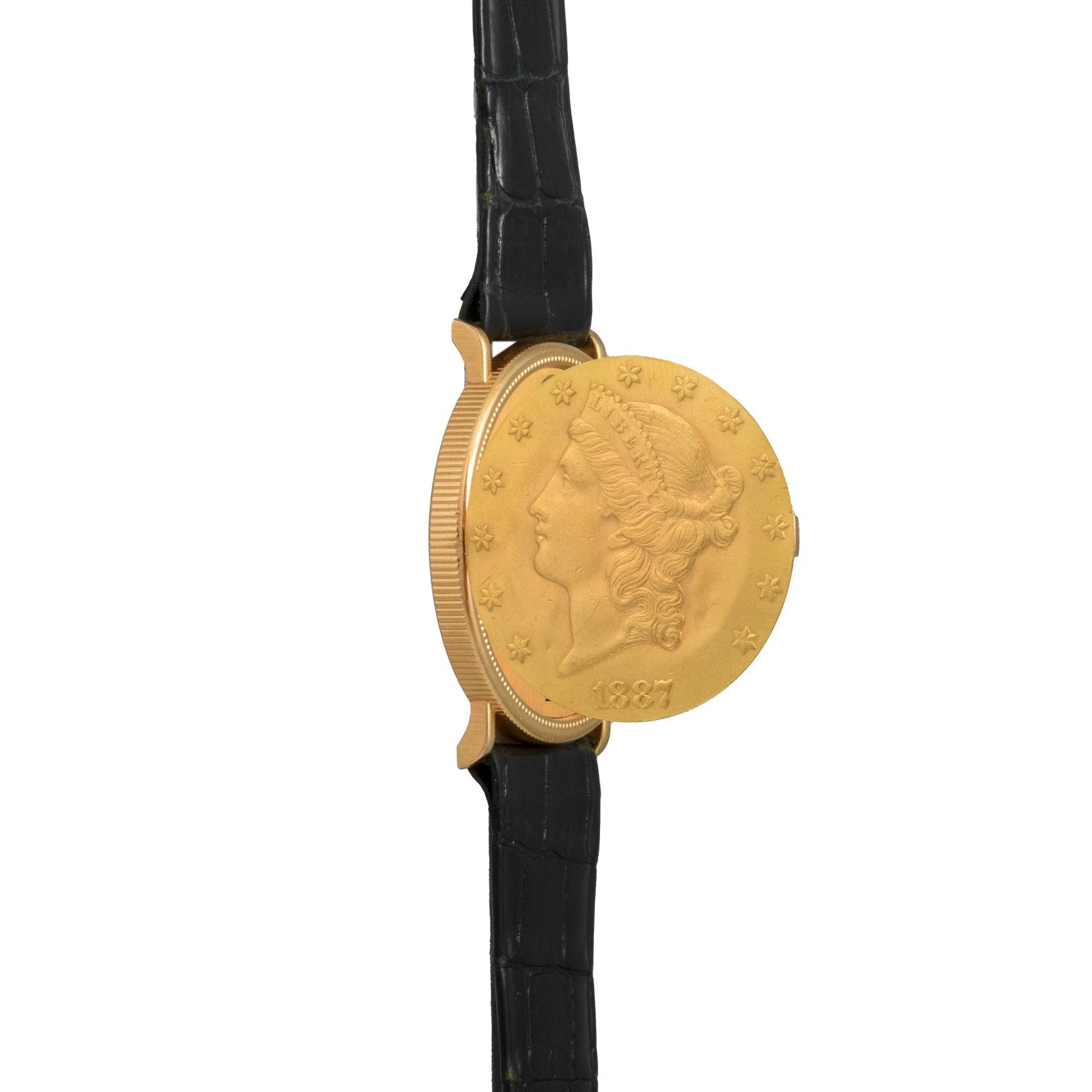 A Piaget 1877 Twenty Dollar Coin Watch with a black leather strap, featuring a gold Lady Liberty coin face.